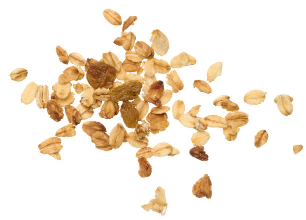 istock Oatmeal, raisins. Granola isolated on background, top view 1962540514
