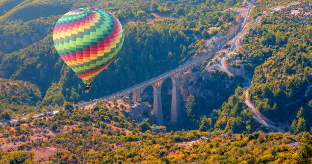 istock Hot air balloon flying over Varda Railway bridge 1962543158