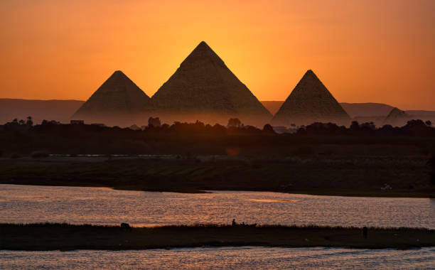 istock Giza pyramid Complex by the Nile at amazing sunset - Egypt 1962551698
