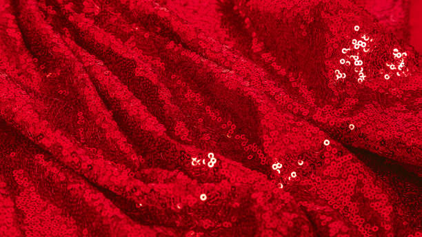 istock Background Sequin. Holiday Abstract glitter Background .Fabric sequins in bright red colors. Fashion Fabric glitter, Sequins. Shiny surface. Banner 1962559618