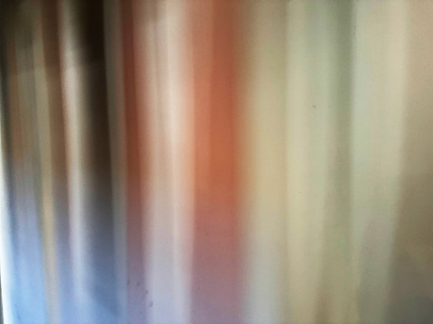 Abstract shadows through a curtain on a wall