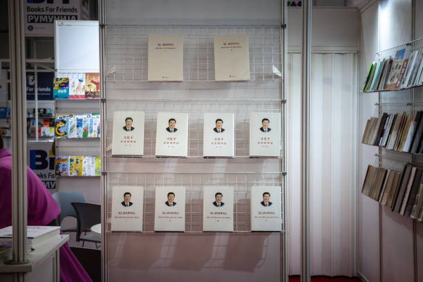 Propaganda books, mainly the book of Chinese President Xi Jinping, Governance of China, for sale on a bookstore shelf selling Chinese propaganda communication. Picture of a chinese bookstore in Belgrade, Serbia, selling books of Xi Jinping. Xi Jinping is a Chinese politician who has been the general secretary of the Chinese Communist Party and chairman of the Central Military Commission, and thus as the paramount leader of China, since 2012. Xi has also been the president of the People's Republic of China since 2013. xi jinping stock pictures, royalty-free photos & images