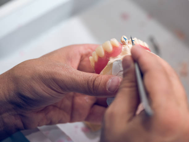 istock Crop dental technician carving denture 1962571309
