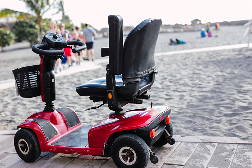 Electric scooter on beach, sustainable mobility concept.