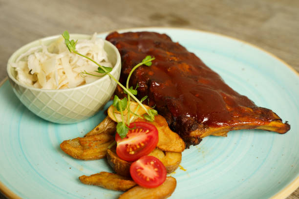 istock BBQ pork ribs with steak potatoes and cabbage salad 1962574587