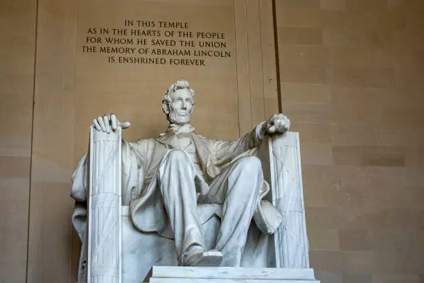 Photo of Abraham Lincoln Memorial on the National Mall in Washington DC (USA), with his typical phrase.