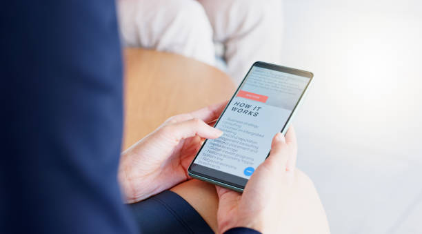 istock Phone screen, website and hands scroll or people with clients review, about us and digital marketing services. Web design, information and faq page of business person on cellphone or user mobile app 1962582215