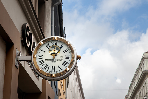 Picture of a sign with the logo of Frederique Constant in front of the Frederique Constant Boutique of Riga, latvia. Frédérique Constant SA is a Swiss manufacture of luxury wristwatches based in Plan-les-Ouates, Geneva. Originally established in 1988 by Dutch married couple Peter Stas and Aletta Stas-Bax, it was acquired in 2016 by Citizen Holdings of Tokyo, Japan.