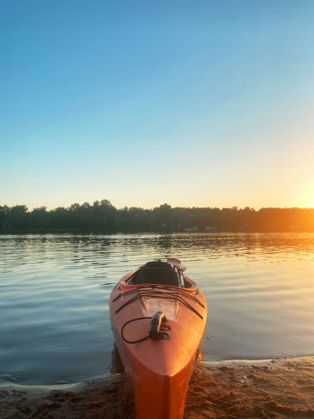 istock kayak on the water at sunset 1962621182
