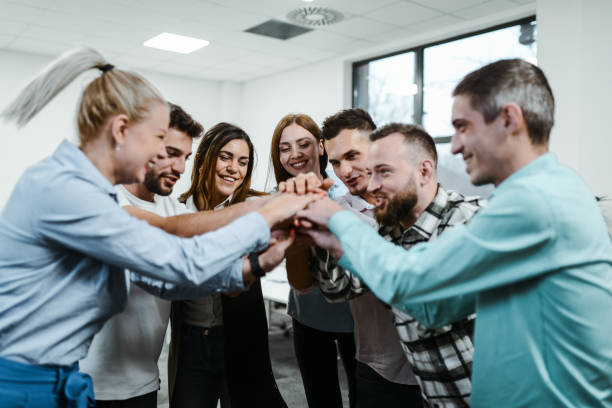 istock Team Spirit By Business Colleagues Working In Office 1962645893