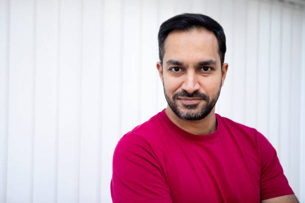 istock Portrait of a confident man against a plain background 1962647604