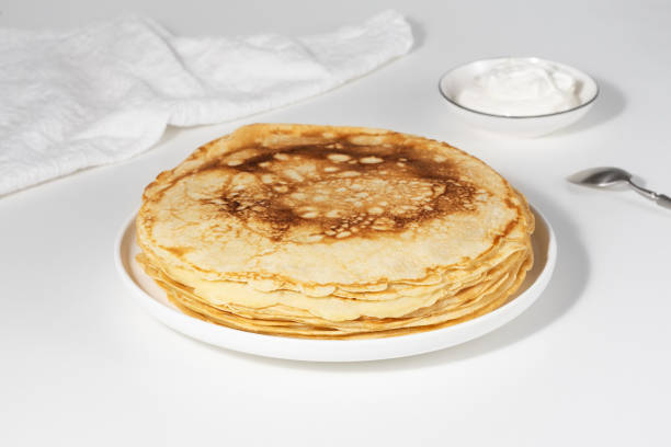 istock Thin pancakes in a plate. Concept of delicious breakfast or Maslenitsa 1962660412