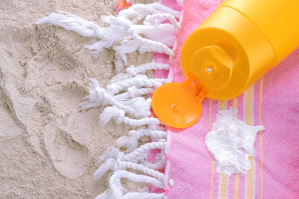 spilled cream on clothes on the beach. White skin care product.