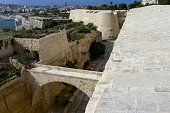 View from the Valletta City Gate bridge to Valletta Ditch and St. John's Bastion in Valletta, Malta