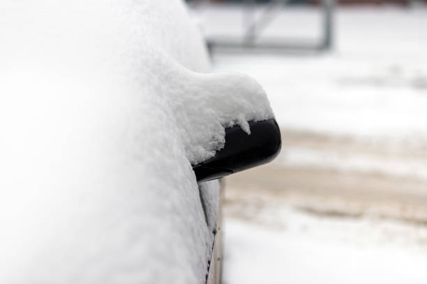 istock One Car parked in the town under the snow. 1962695853