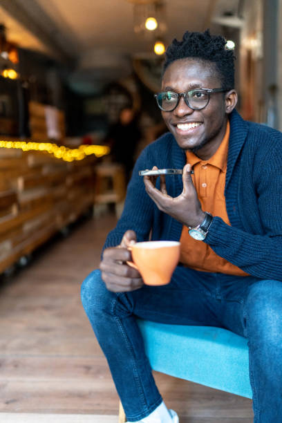 istock Cheerful young man having phone call 1962703278
