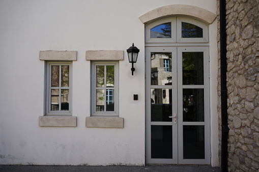 3d rendering of a modern entrance door with canopy and plants