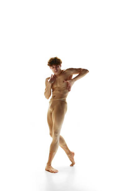 contemporary ballet. talented, shirtless man, ballet dancer in beige pants dancing in motion against white studio background. - motion art naked studio shot imagens e fotografias de stock