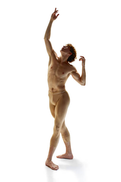 fourth position. young man, modern ballet dancer with athletic body dancing against white studio background. - motion art naked studio shot imagens e fotografias de stock