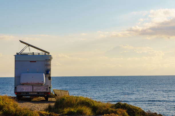 istock Caravan with tilt solar panels on roof. 1962748955
