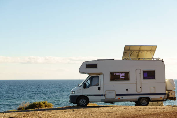istock Caravan with tilt solar panels on roof. 1962750064
