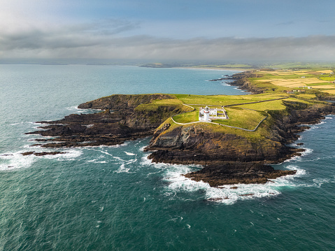 Galley Head Lighthouse is located in County Cork, Ireland. It is situated on the Galley Head peninsula, overlooking the Celtic Sea. The lighthouse was built in 1875 and stands at an elevation of 53 meters