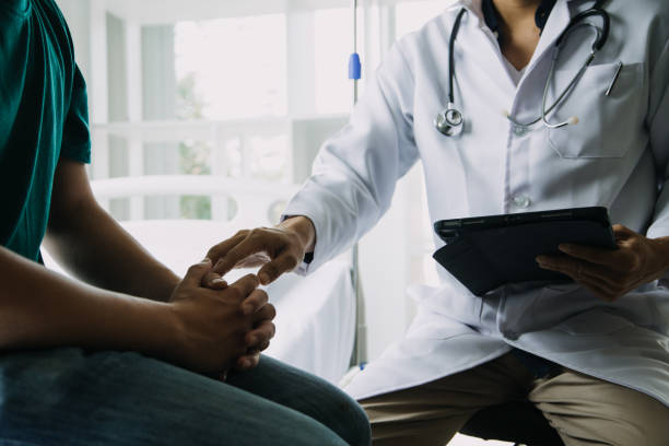 istock close up of patient and doctor taking notes 1962782105