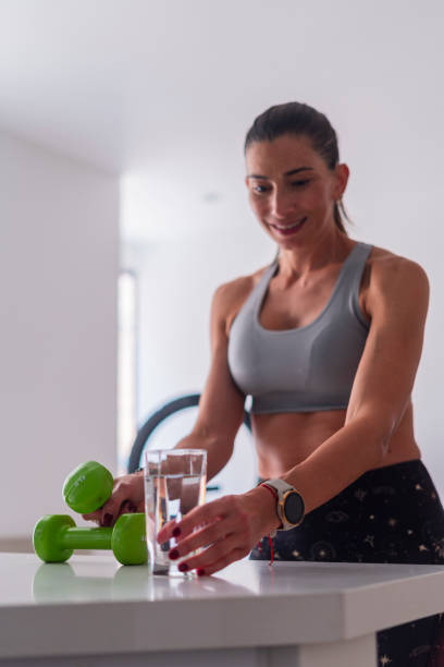 istock Latin woman at home is exercising 1962811691
