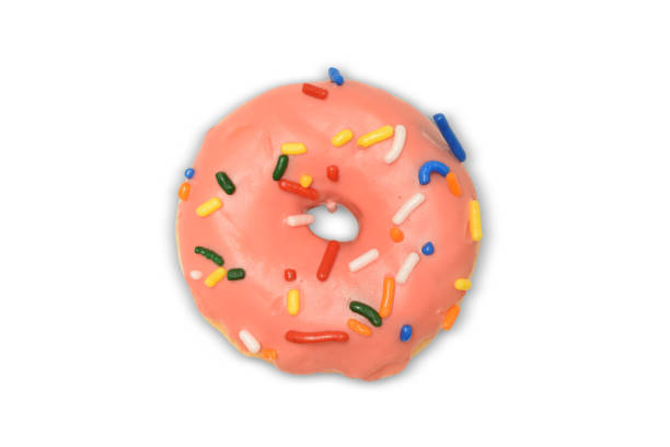 istock Cheerful pink frosted donut with sprinkles on white background with clipping path - doughnut isolated 1962818535