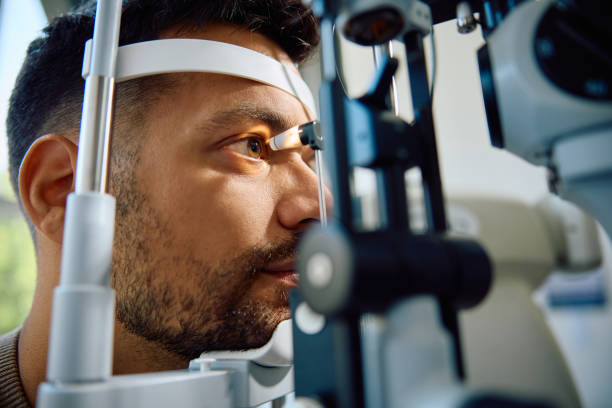 istock Close up of man during eye exam at ophthalmologist's. 1962819650