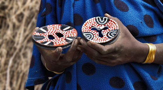 Ceramic Lip Plates and bracelets for sale to tourists as souvenir, in a Mursi tribe village, Omo Valley, Ethiopia
