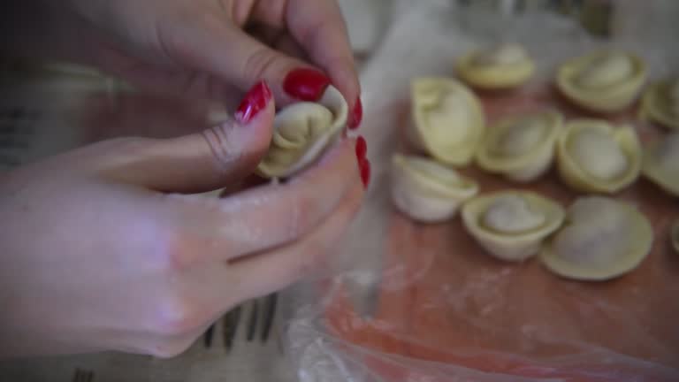 Woman making domestic dumplings