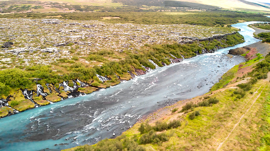 Aerial view of Beautiful blue river and rock formations at Barnafoss waterfalls in Western Iceland.
