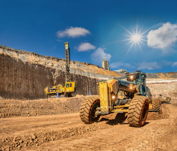 istock grader and drilling rig ,digging and loading kimberlite at the plant in the diamond mine ,daytime. 1962864405