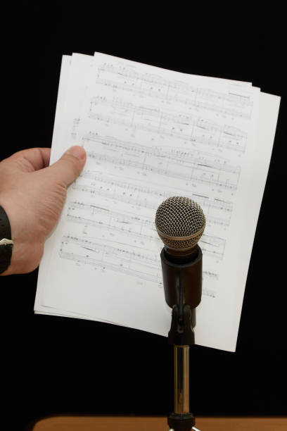Microphone on a Stand in Colorfully Lit Event Stage Closeup