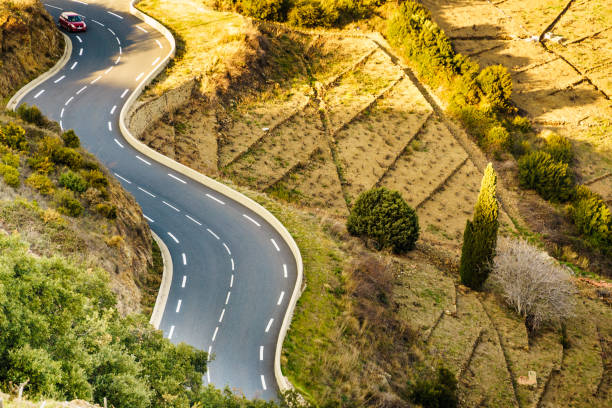 istock Winding asphalt road in France 1962879340