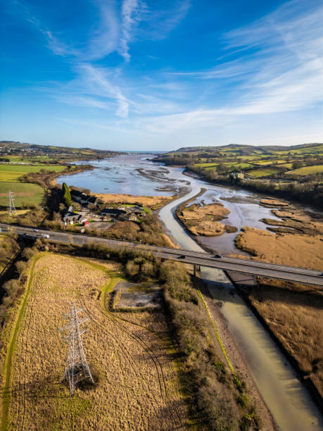 istock Electricity pylon, road bridge, river Teign 1962884008