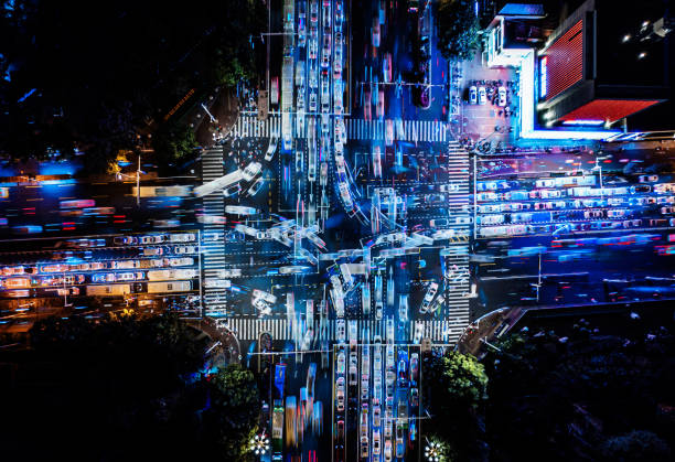 drone point view of city street crossing at night - cross zdjęcia i obrazy z banku zdjęć