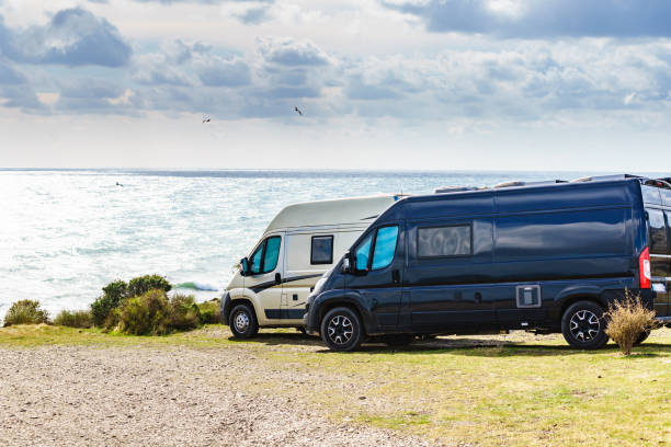 istock Caravan vans camping on sea shore 1962930511