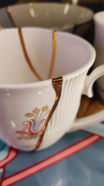 Coffee cup with japanese kintsugi technique for repairing broken ceramics