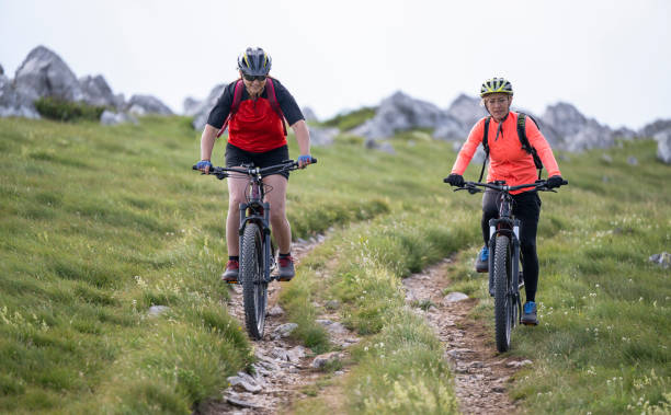 istock Two Women Riding Electric Mountain Bikes 1962951024