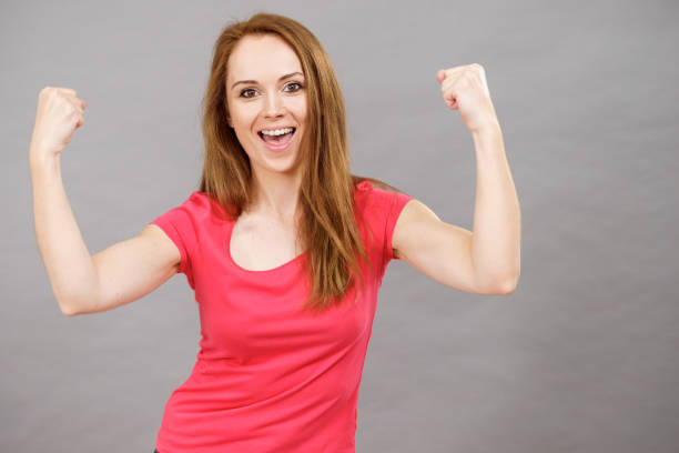 istock Joyful woman screaming yes clenching fists 1962952078