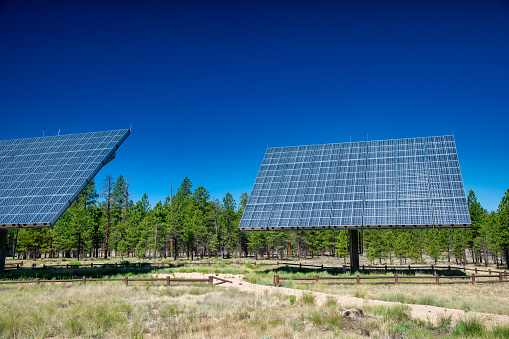 Solar panels against the background of the sky. Solar power plant. Blue solar panels. Alternative source of electricity. Solar farm.