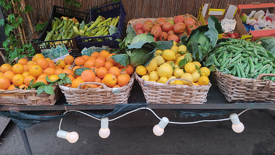 fruit and vegetable stand of outdoor greengrocer in Liguria, Italy