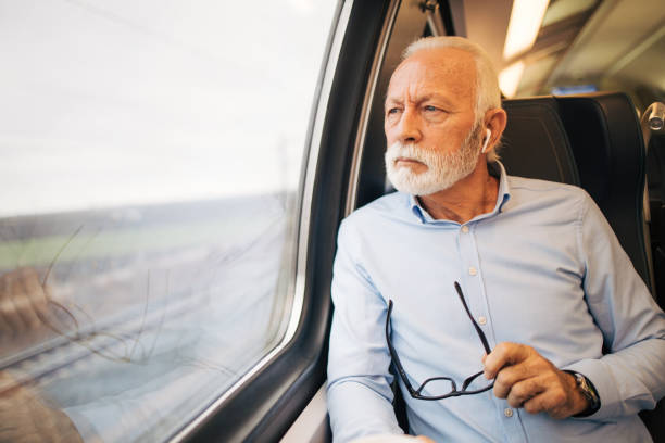 istock Thoughtful senior man travelling by train 1962989945