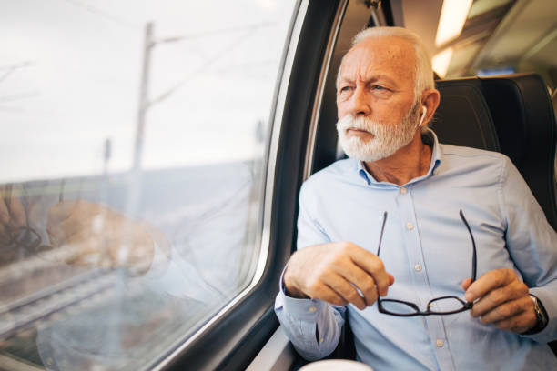 istock Thoughtful senior man travelling by train 1962992059