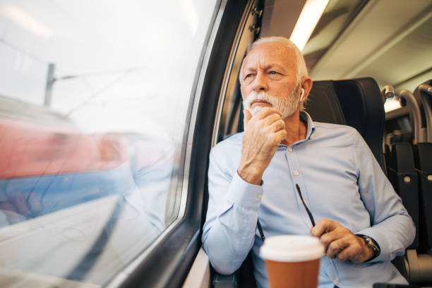 istock Thoughtful senior man travelling by train 1962992589