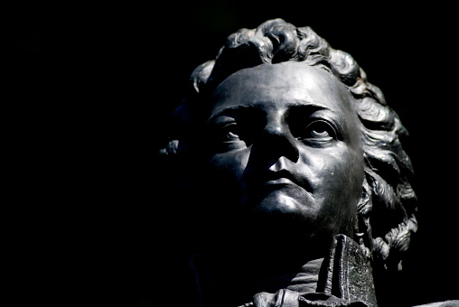 closeup of Bronce Portrait of Wolfgang Amadeus Mozart on Kapuzinerberg, Salzburg, Austria