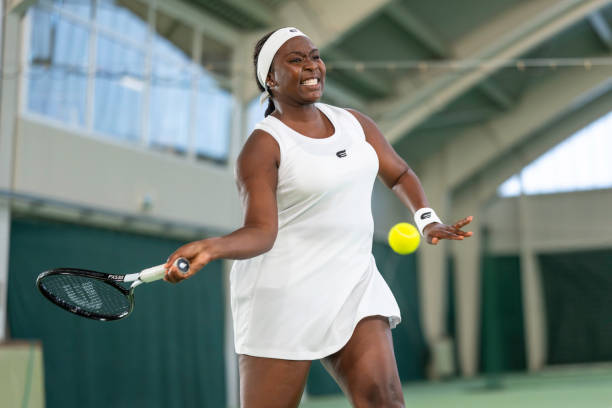 istock Tennis player hitting ball with racket 1963009600