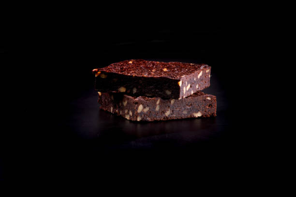istock two chestnut brownies isolated on black background 1963023878